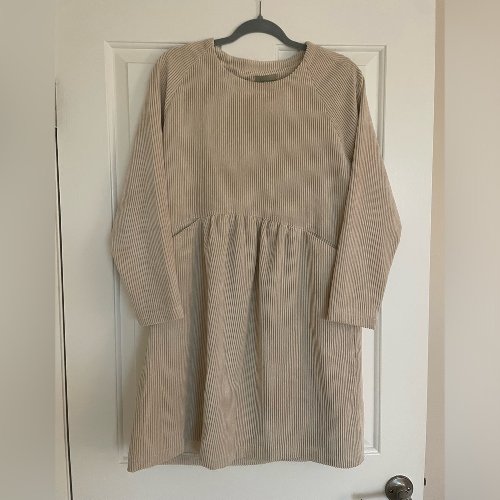 Cream color dress.